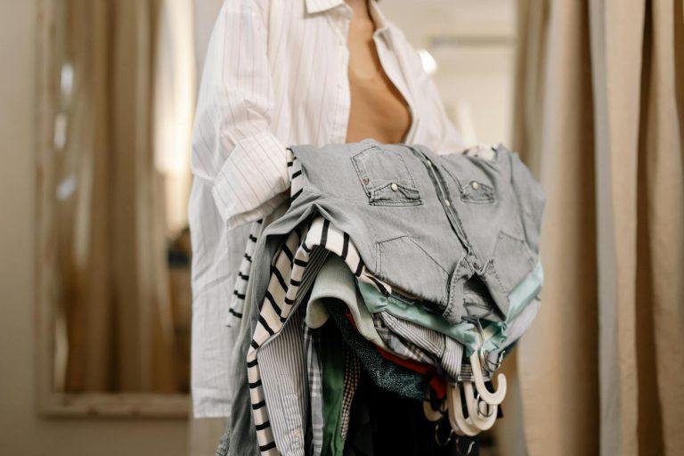 Woman posing in stylish, affordable, well-coordinated clothing on a city street.
