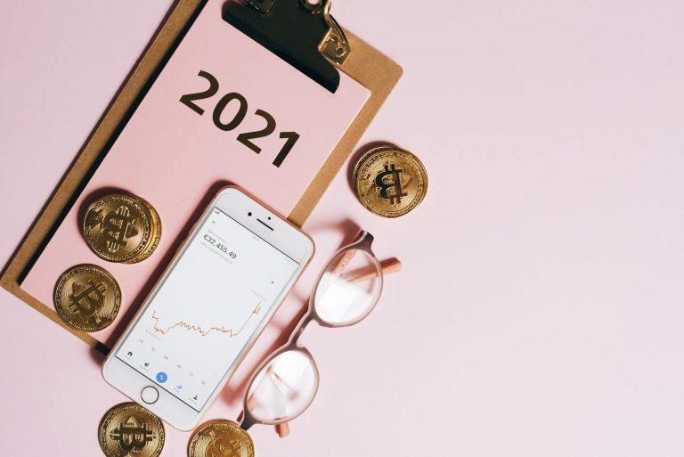 Woman pointing to a room with dated, overly personalized wallpaper.